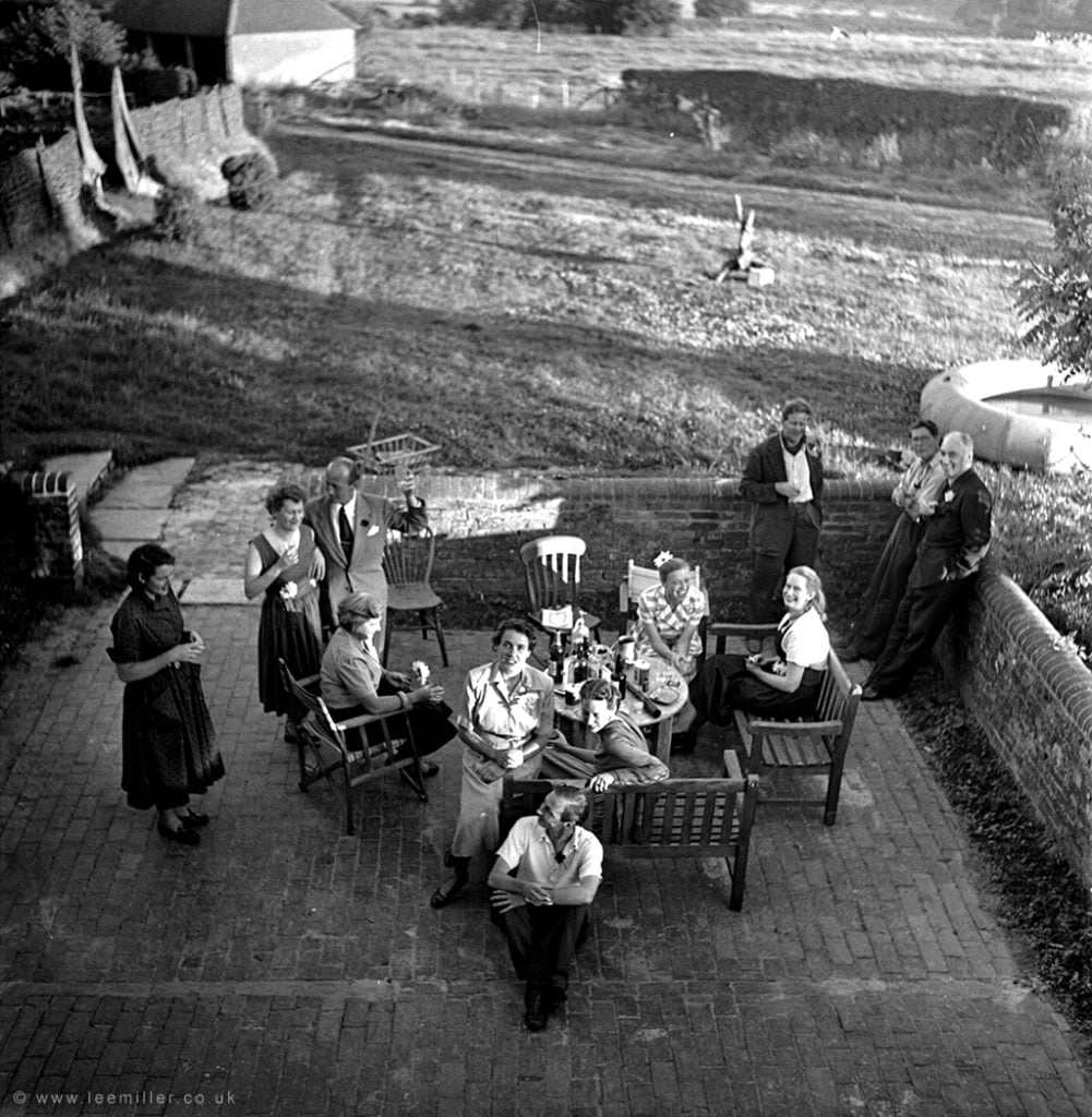 Gathering of friends in the courtyard at Farleys in the 1950's by Lee Miller